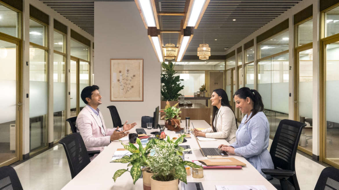 How can shared workspaces help startups grow?